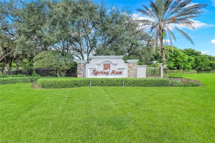 Community sign featuring view of scattered trees