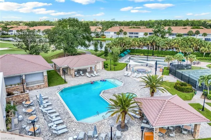 Community pool with a patio, a water view, and a residential view