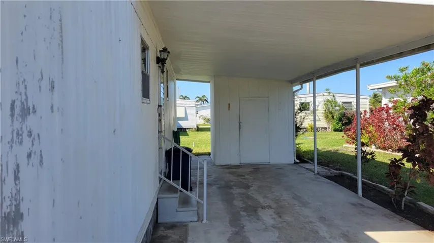 View of patio featuring a carport
