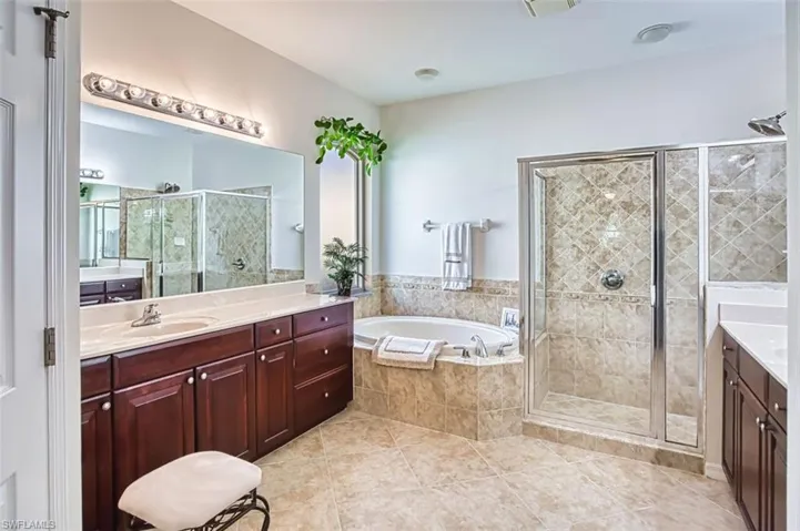 Large Primary En Suite Featuring Double Sinks, Walk in Shower & Soaking Tub