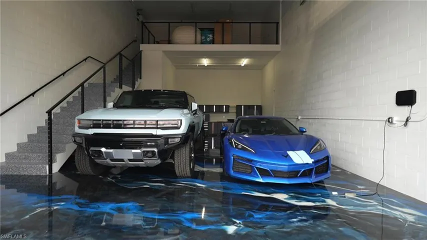 Garage featuring concrete block wall
