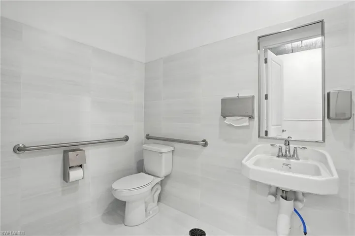 Bathroom featuring tile walls and tile patterned floors
