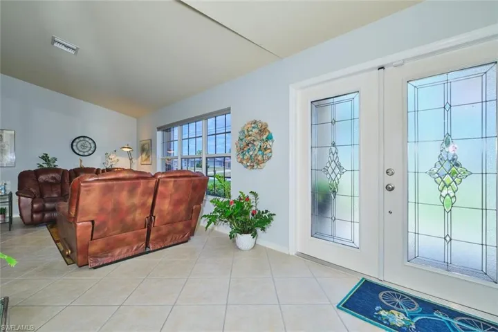 tile floor and ceiling fan, sliding door to lanai