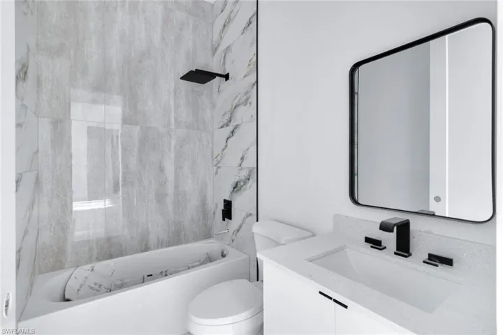 Full bathroom with vanity and bathtub / shower combination