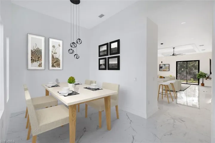 Dining room with light marble finish flooring and a ceiling fan
