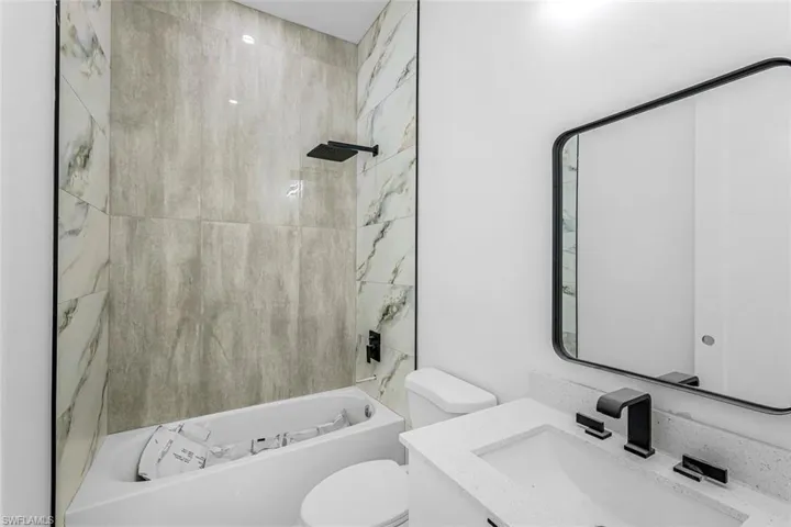 Full bathroom with vanity and tub / shower combination