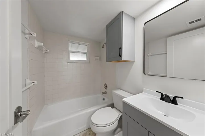 Full bath with vanity and tub / shower combination