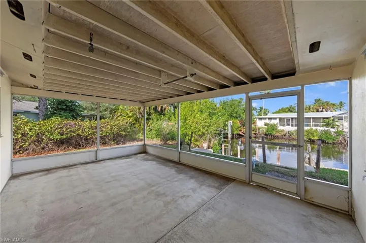 Sunroom with a water view