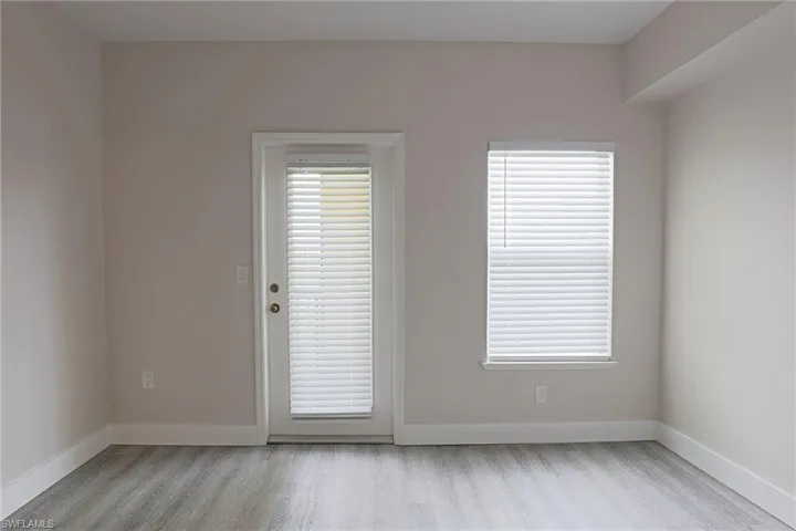 Spare room with light wood finished floors and baseboards