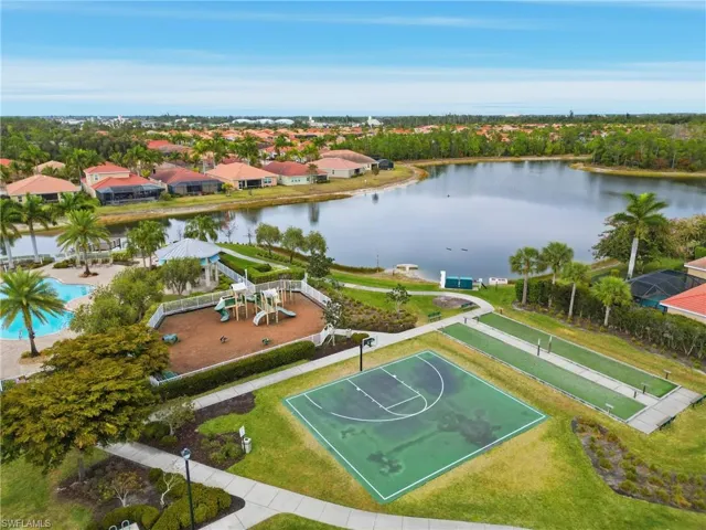 Aerial perspective of suburban area with a large body of water