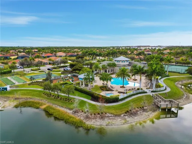 Aerial view of residential area featuring a large body of water