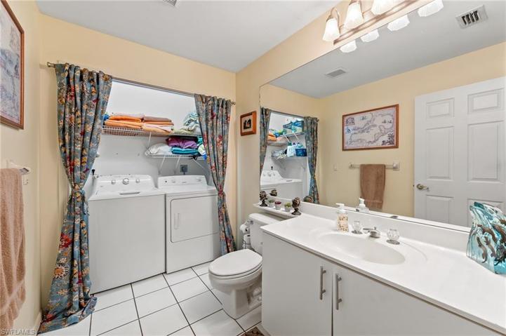 downstairs guest bath with laundry.