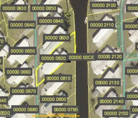 Aerial view of property on canal (outlined in yellow)