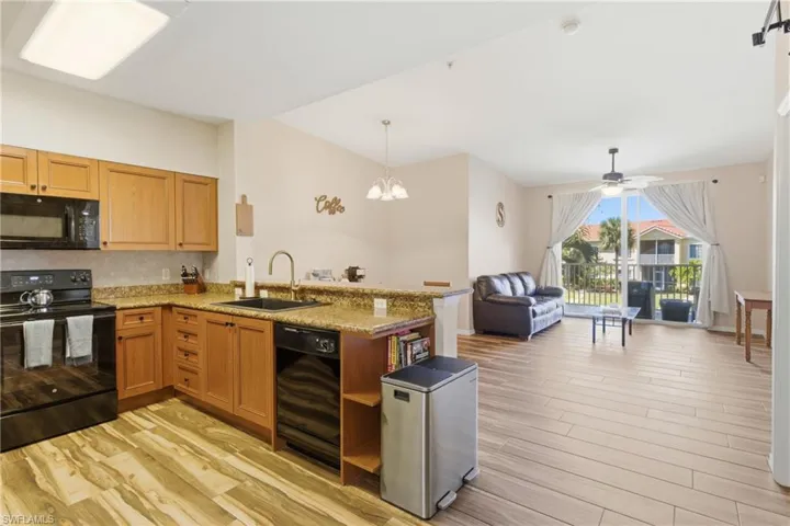 Elegant flow from living to kitchen enhances daily living and gatherings.