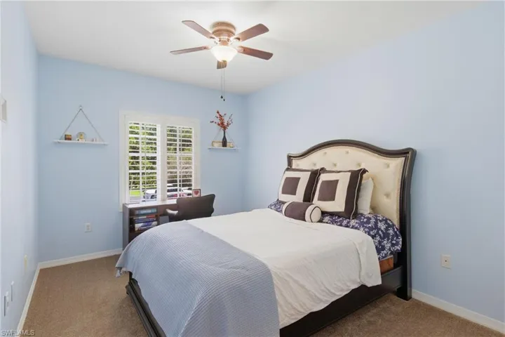 Freshly painted guest room with newer carpet and ample closet space.