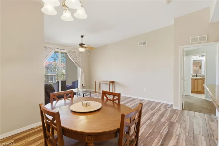 Comfortable dining space ideal for hosting, just off the kitchen and living room.