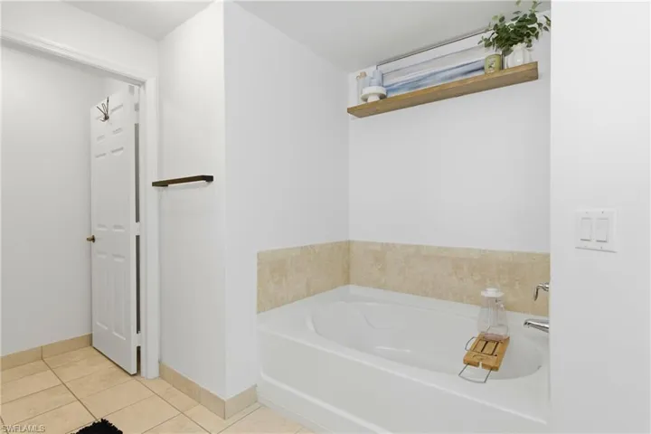 Spa-like bathroom with new mirrors, faucets, and refreshed finishes (2024).