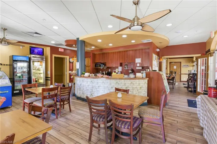 Vibrant atmosphere with seating, food, and drinks for all occasions.