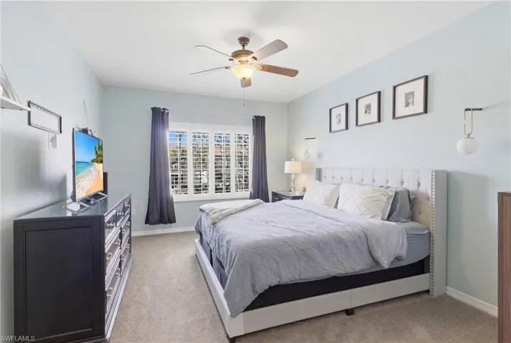 Generously sized with plantation shutters and neutral tones for calm.