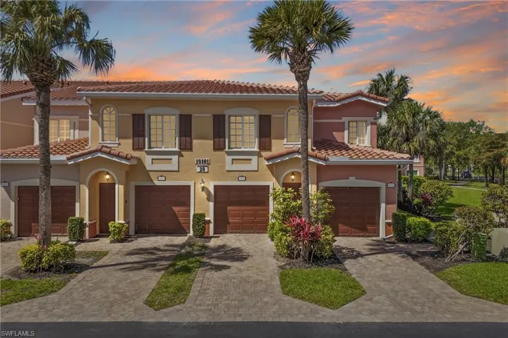 Dramatic front view as the sun sets, highlighting the architecture and landscaping.