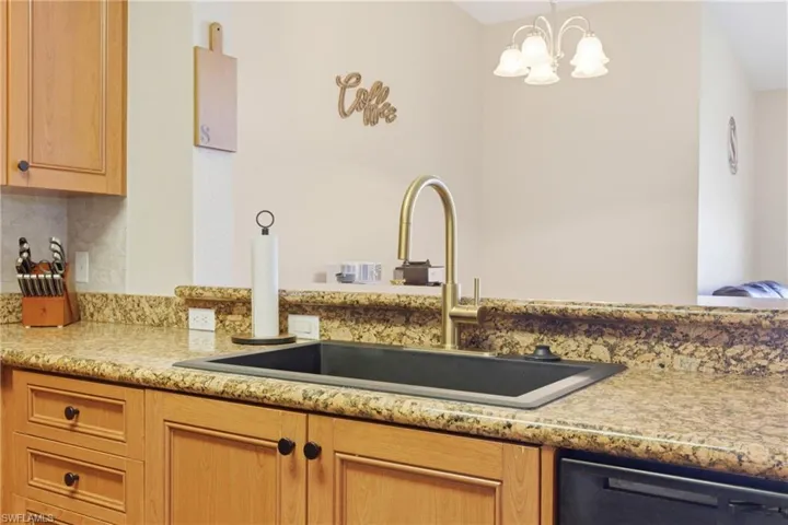 Upgraded sink and faucet with stylish finishes and functional design.