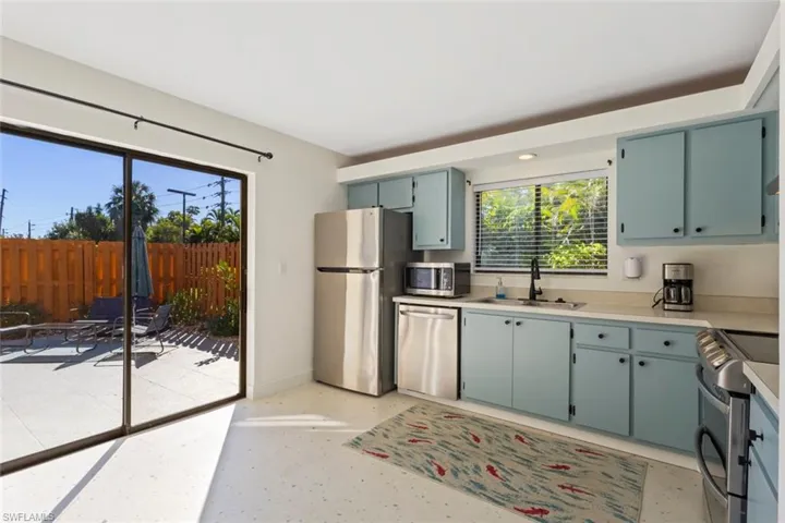 Kitchen featuring stainless steel appliances and light countertops