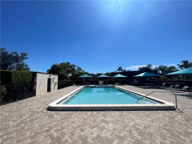 Community pool featuring a patio area