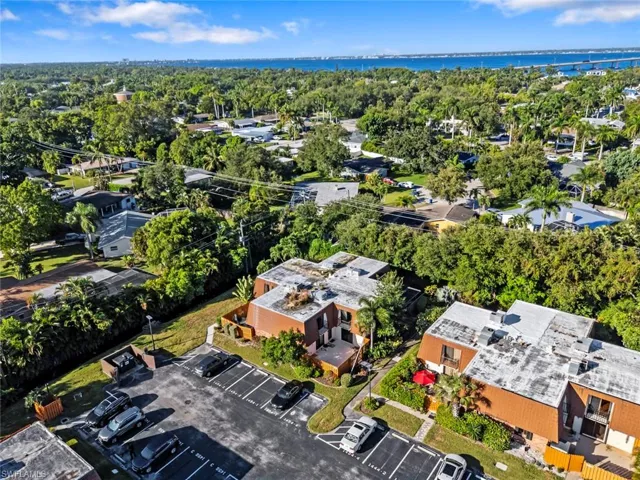 Aerial perspective of suburban area with a tree filled landscape
