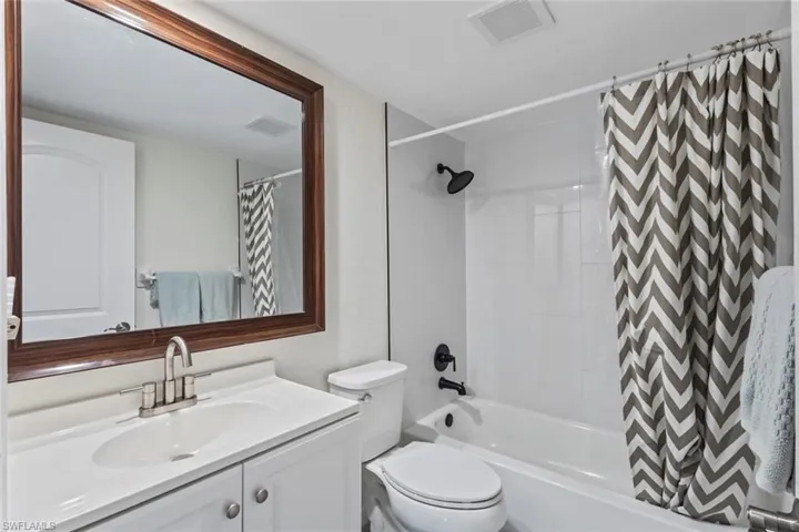 2nd floor guest Bathroom with shower / bath combination with curtain and vanity