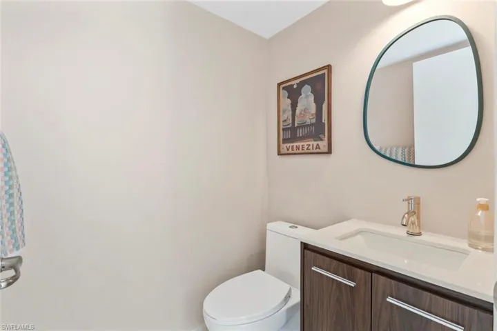 Half bath with vanity and toilet