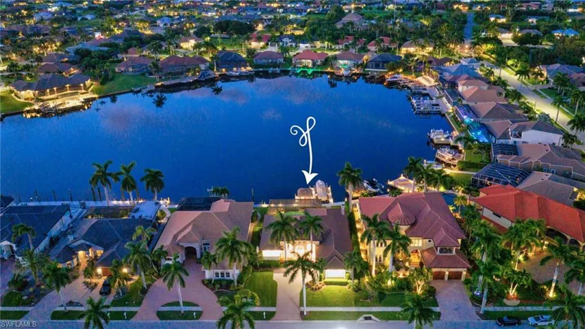 Night photo highlighting lit up home location overlooking Roundtable Lake