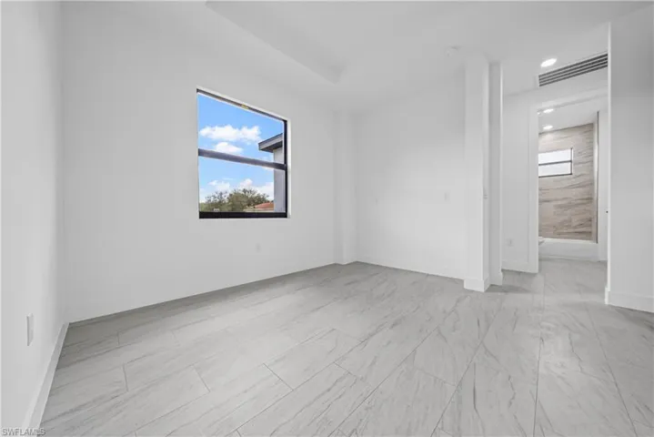 Unfurnished room with baseboards and recessed lighting