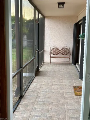 Unfurnished sunroom with a balcony
