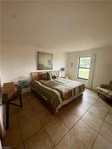 Bedroom featuring tile patterned flooring