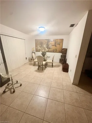Dining area featuring light tile patterned floors