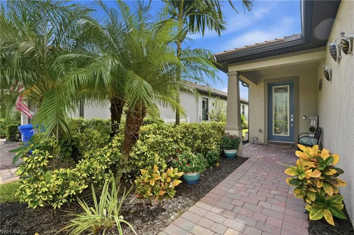 Entrance to property with stucco siding