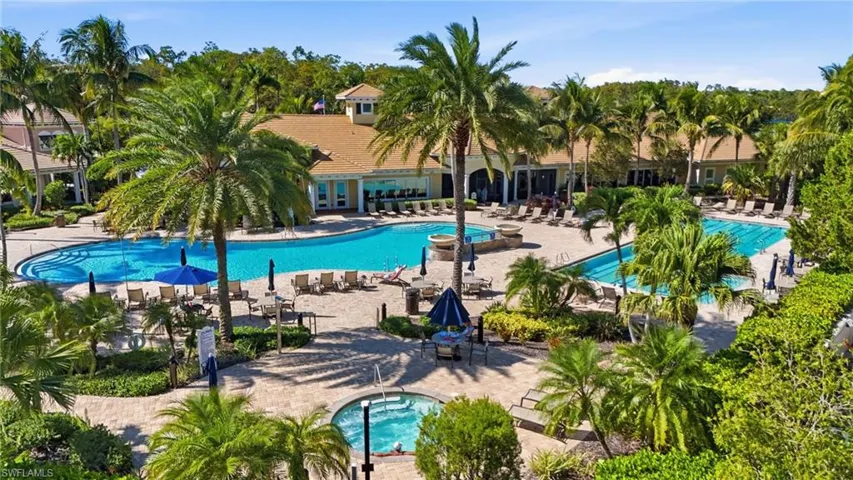 Community pool with a patio