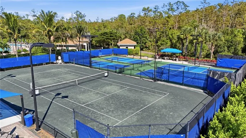 View of tennis court with community basketball court