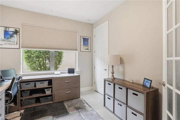 Office featuring light tile patterned floors and baseboards