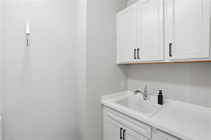 Laundry area with a sink