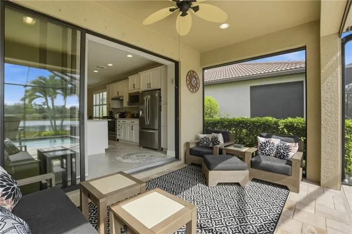 View of patio with ceiling fan and an outdoor hangout area