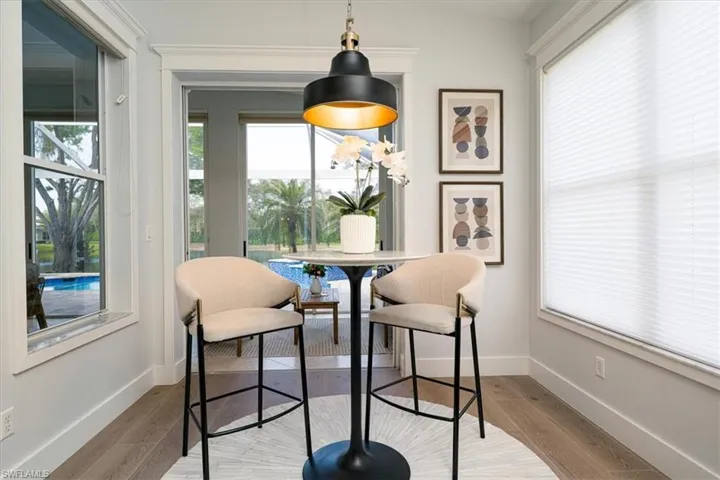 Dining area with light wood-style floors