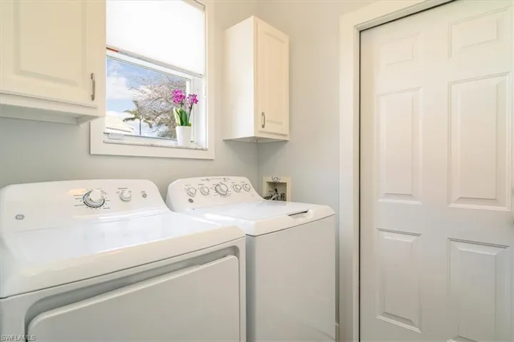 Laundry room with washer and dryer and cabinet space