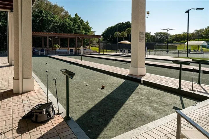 View of property's community with a bocce ball area