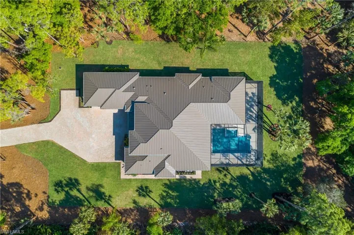 View of property with a pool