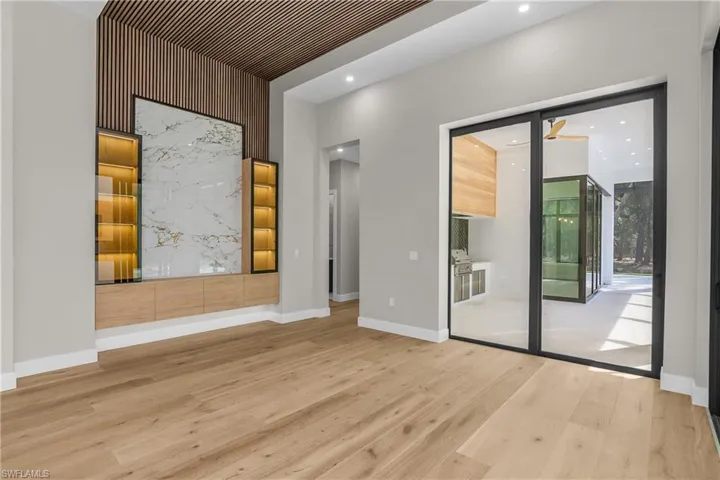 Unfurnished room with light wood-style flooring and baseboards