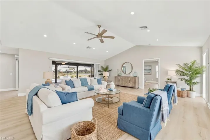 Living room featuring light wood finished floors, ceiling fan, and recessed lighting