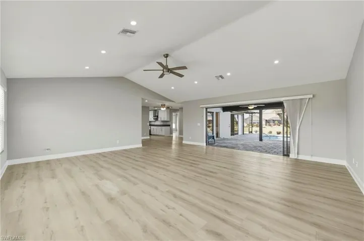 Unfurnished living room featuring ceiling fan, light wood-style flooring, and recessed lighting