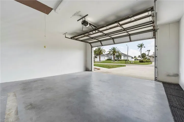 Garage with a residential view and a garage door opener