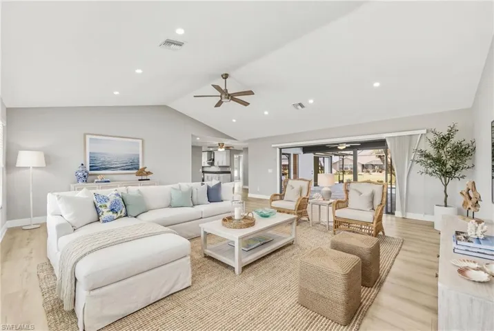 Living room featuring ceiling fan, light wood-style floors, and recessed lighting